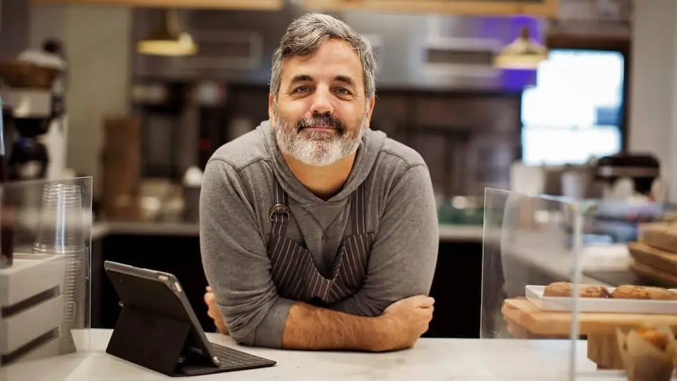 Man at his cafe working